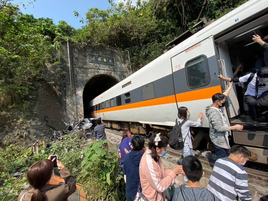 Taiwan train crashes into truck and derails, kills 36 and injures many