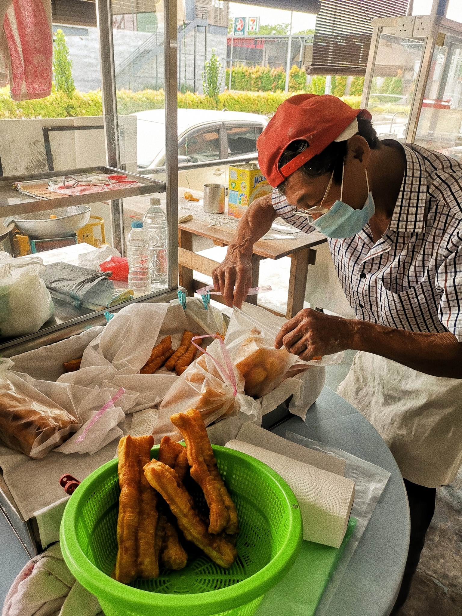 "I only earn RM5 a day" 75yo uncle braves FMCO storm by selling "youtiao" at RM1 each