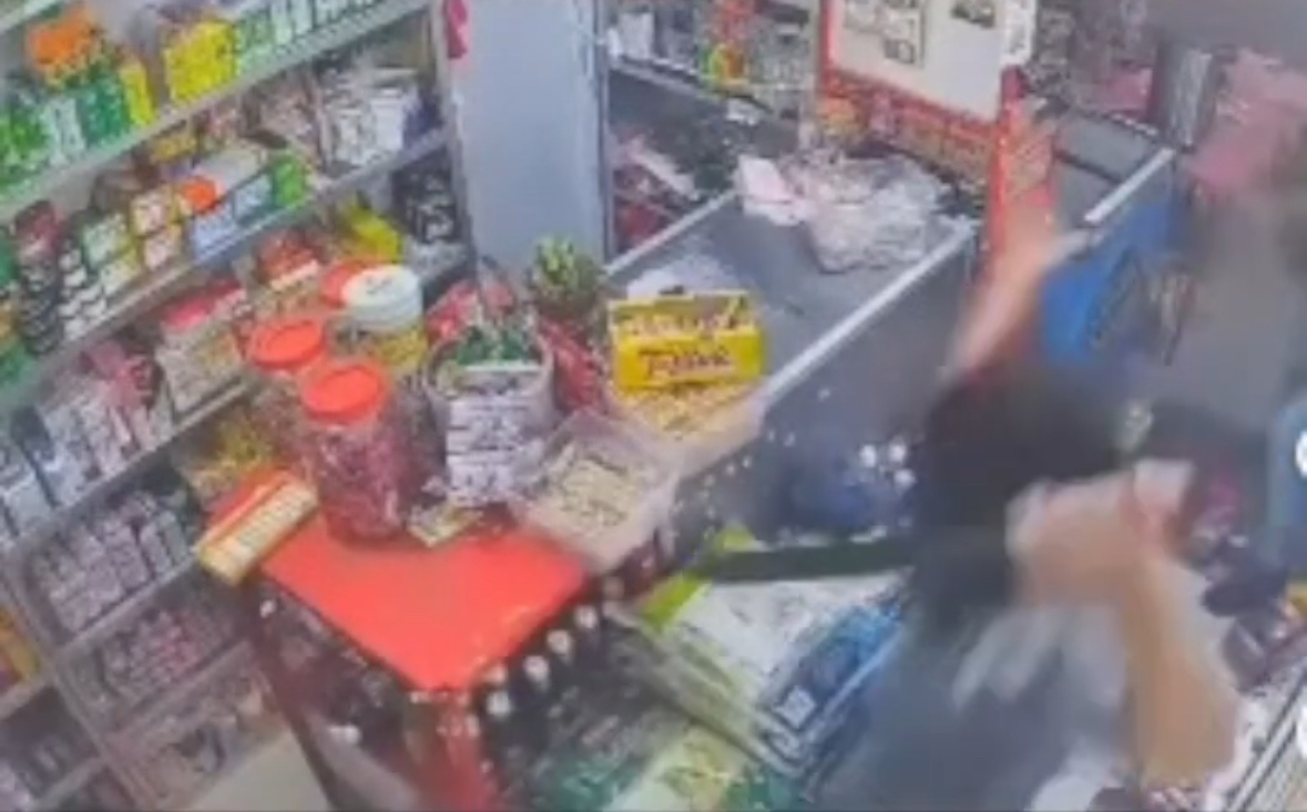 Fearless Shop Owner Fights Off Armed Robbers With Parang In Viral CCTV Footage