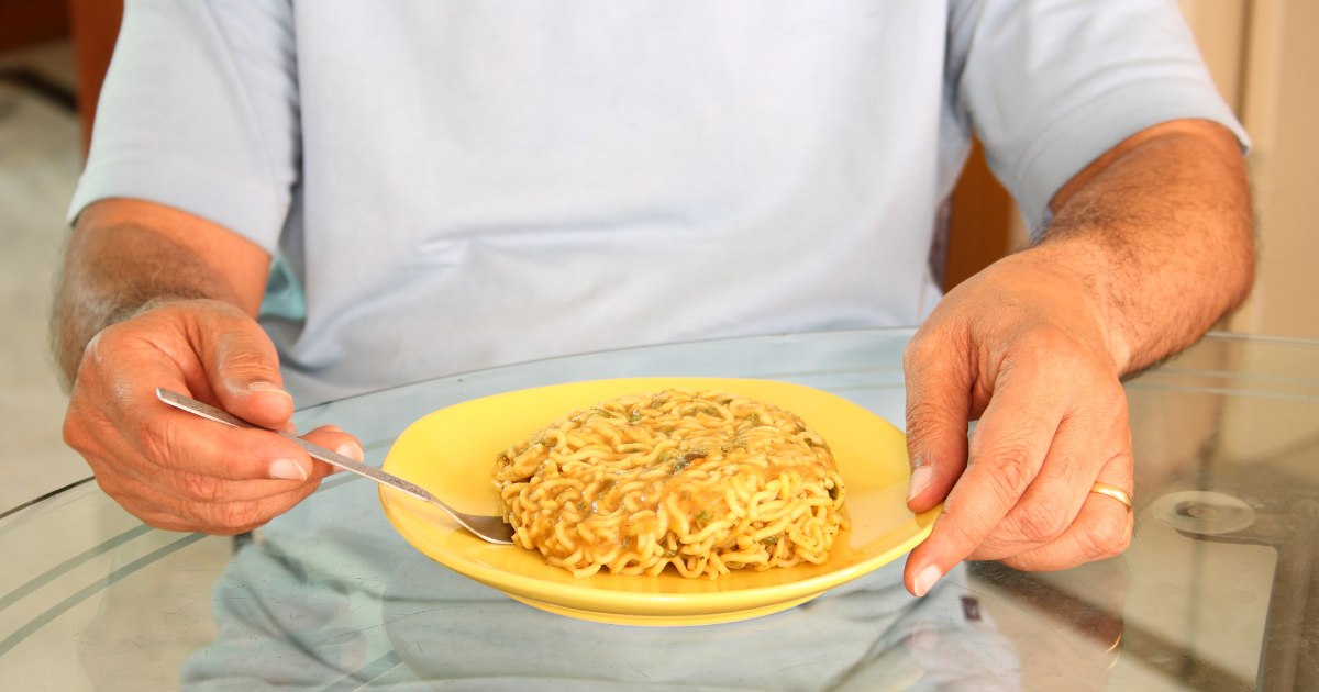 man eating maggi