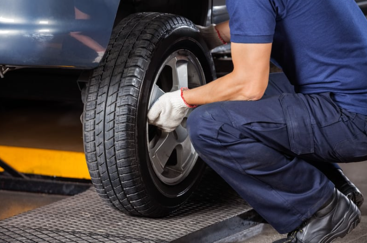 Mechanic fixing car