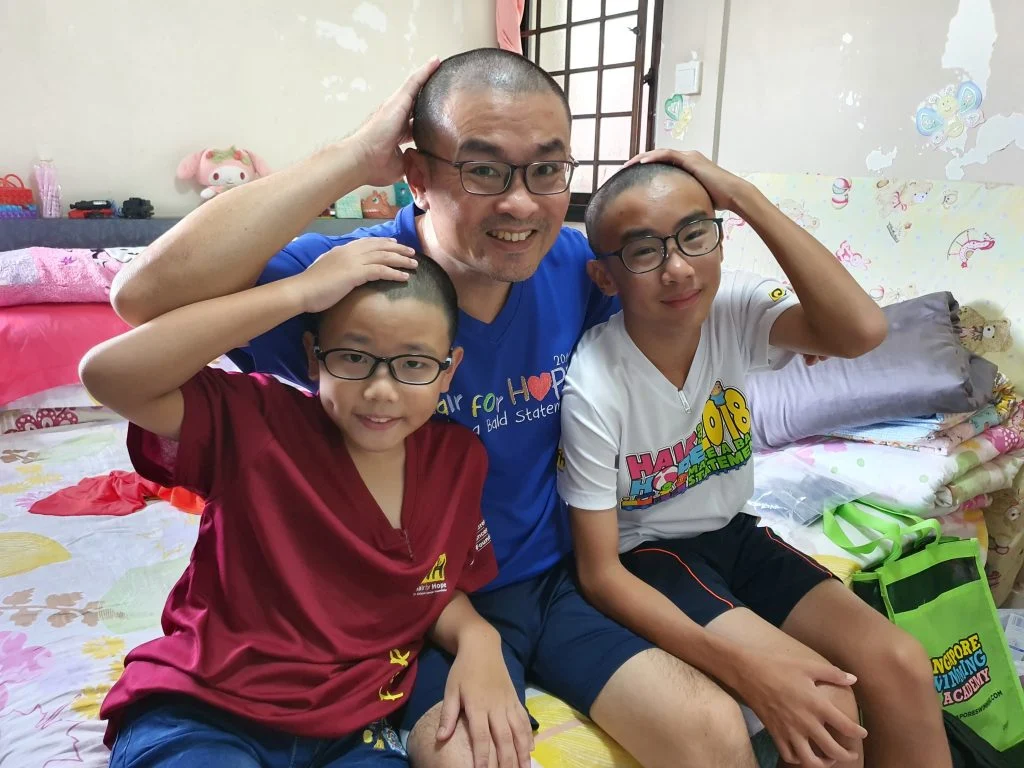 Mira, Austin and their dad shaving their heads
