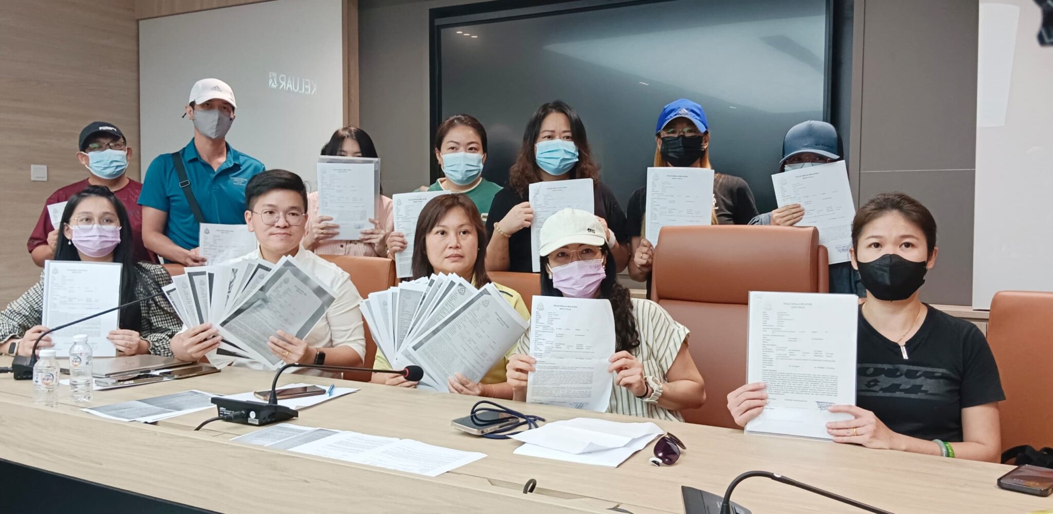 msians showing their police report