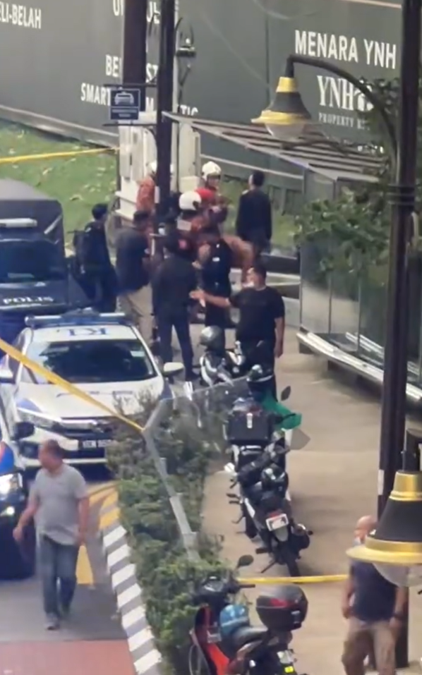 Police and firefighters find body hanging from tree