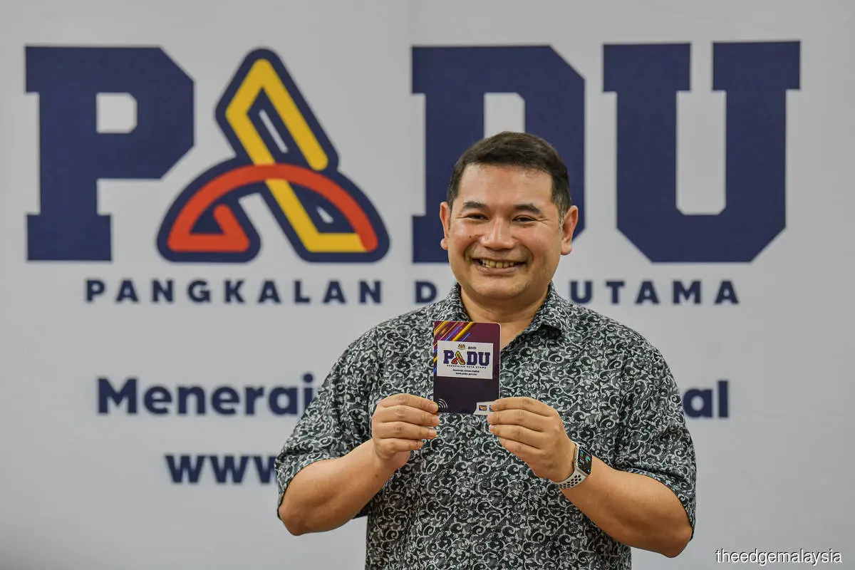 Rafizi with PADU logo