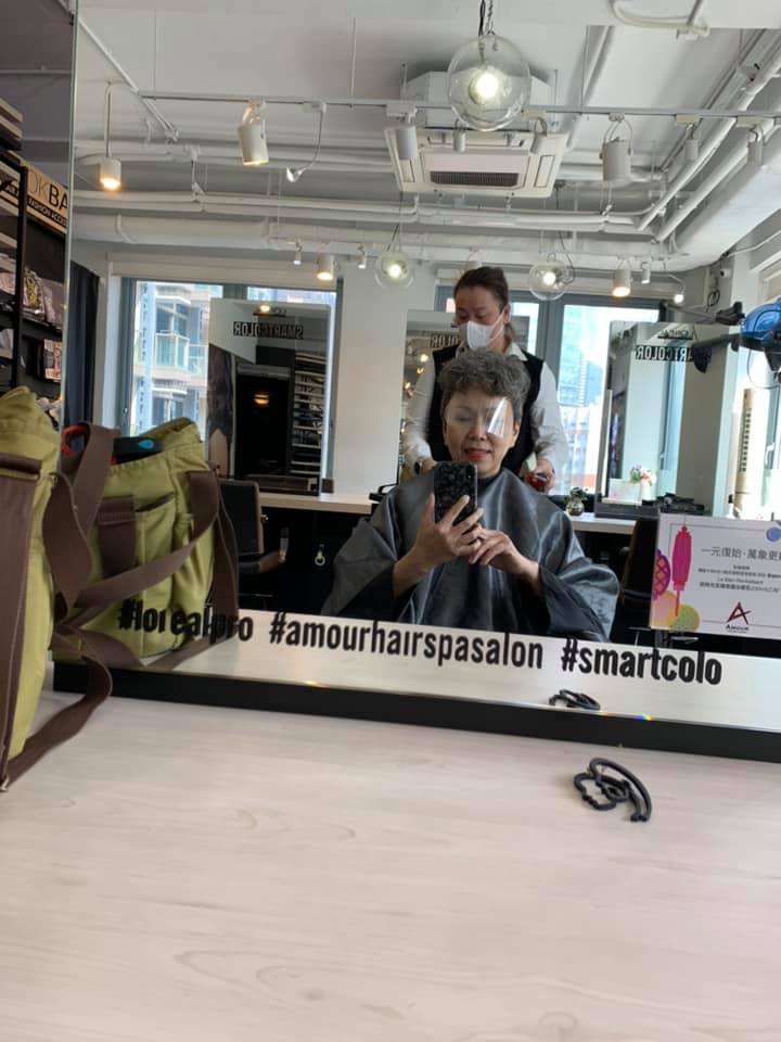 Sam and Connie, a customer who flew all the way to Hong Kong for haircut