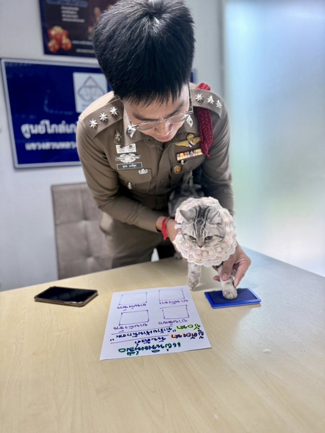 Thai police with cat