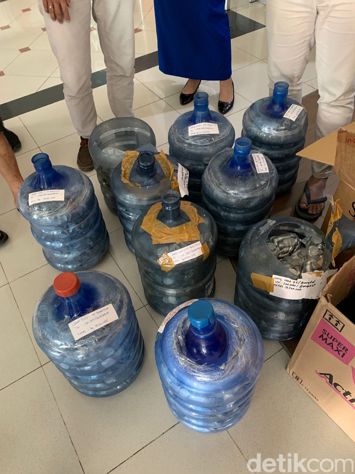 water barrels filled to the brim with coins