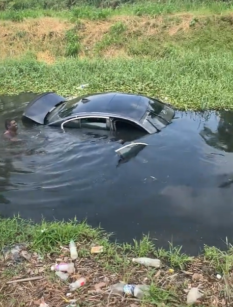 Towing car in drain water