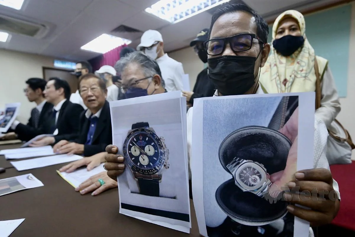 victim showing watches scammed by a woman
